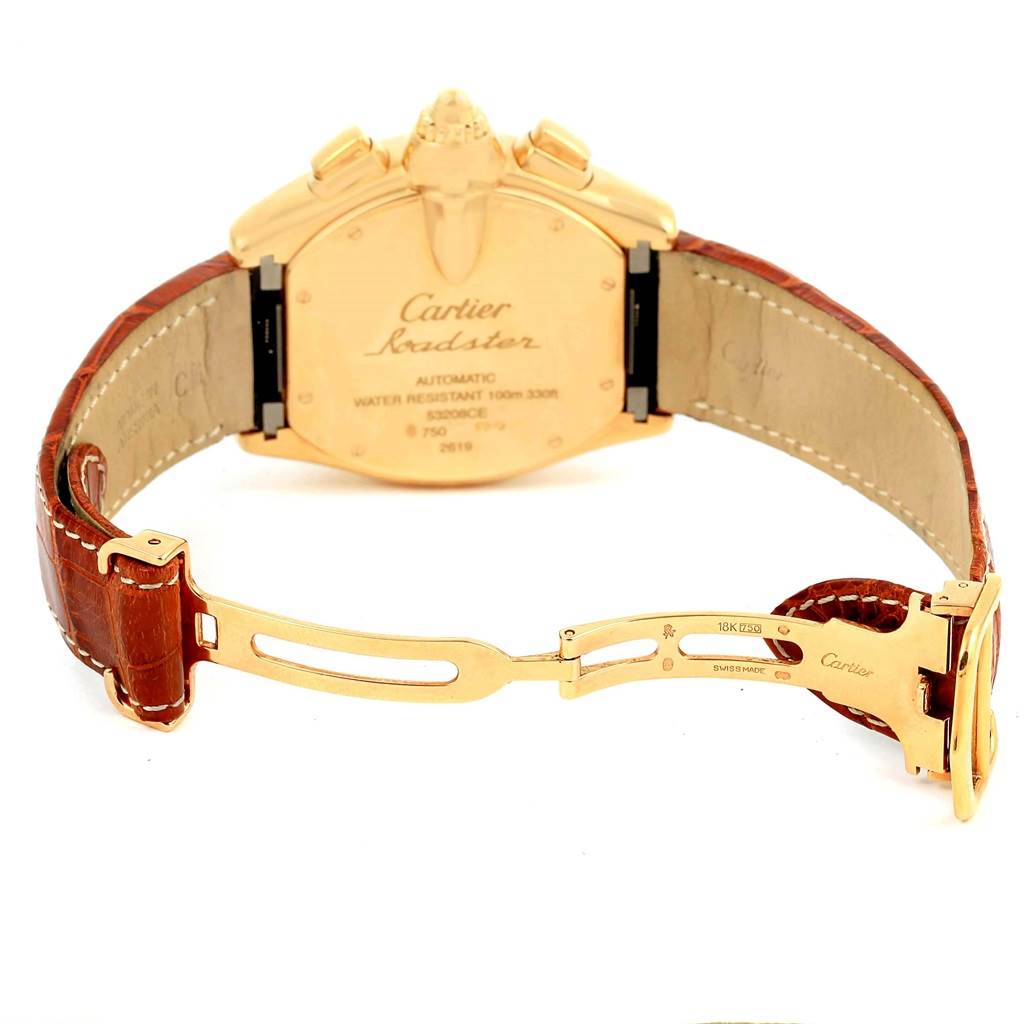 The image shows the back view of the Cartier Roadster W62021Y3 Men
s Yellow Gold Champagne Dial W62021Y3 Men
s Yellow Gold Champagne Dial watch, highlighting its caseback and brown leather strap with gold clasp.