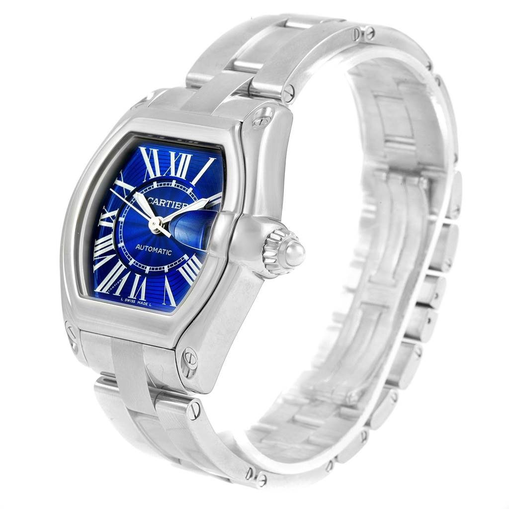 This image shows a Cartier Roadster W62048V3 Men's Stainless Steel Blue Dial W62048V3 Men's Stainless Steel Blue Dial watch at a three-quarter angle, highlighting its face, bezel, and bracelet.