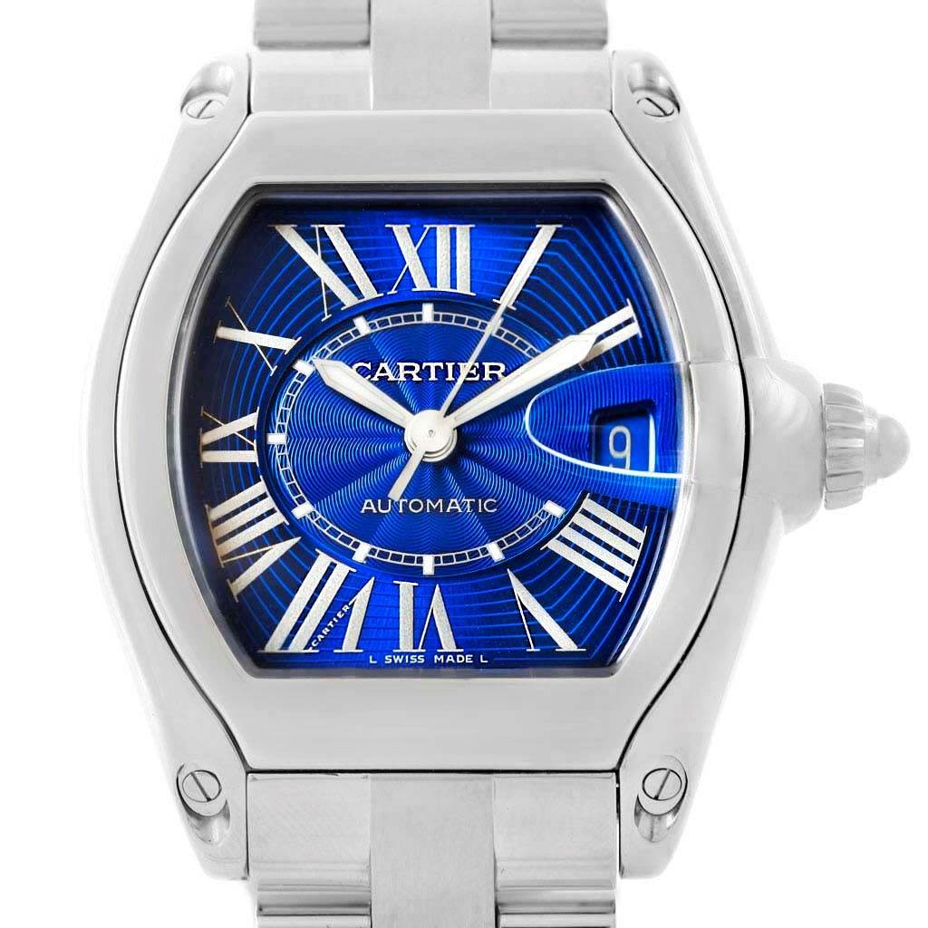 The image shows a Cartier Roadster W62048V3 Men's Stainless Steel Blue Dial W62048V3 Men's Stainless Steel Blue Dial watch from a front angle, highlighting the dial, hands, and part of the bracelet.
