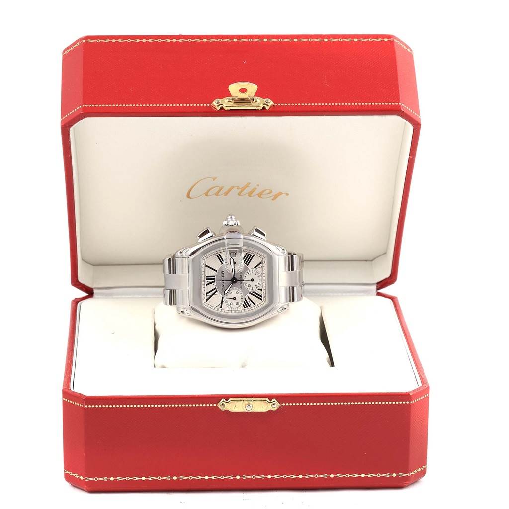 The Roadster model by Cartier is shown from the front, inside its open red Cartier box.