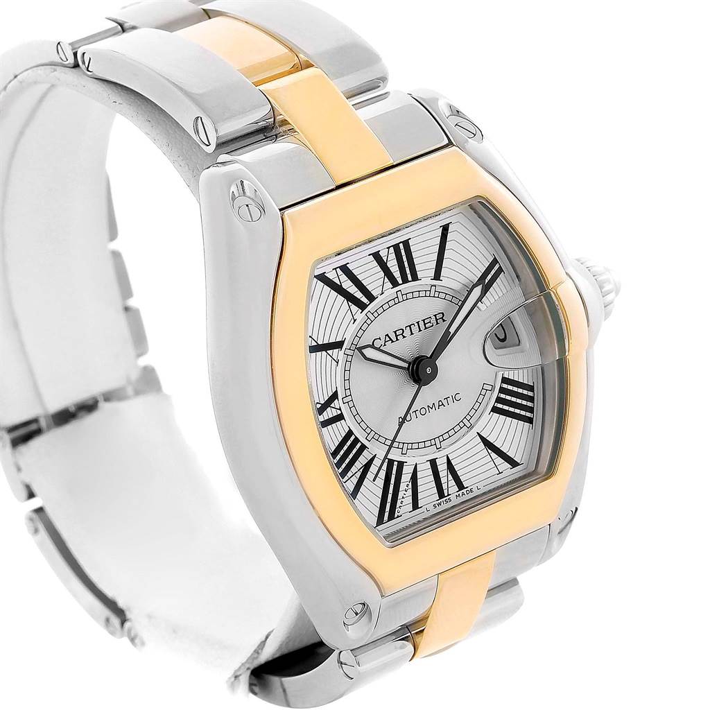 This Cartier Roadster W62031Y4 Men's Steel and Gold (two tone) Silver Dial W62031Y4 Men's Steel and Gold (two tone) Silver Dial watch is shown at an angle displaying the face, case, bezel, and partial bracelet.