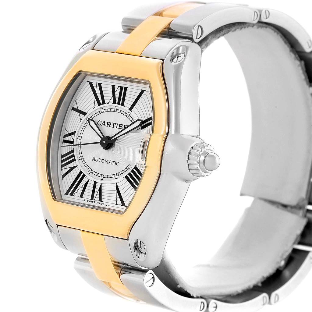 The image shows a side and angled top view of the Cartier Roadster W62031Y4 Men's Steel and Gold (two tone) Silver Dial W62031Y4 Men's Steel and Gold (two tone) Silver Dial watch, highlighting its dial, crown, and part of the bracelet.