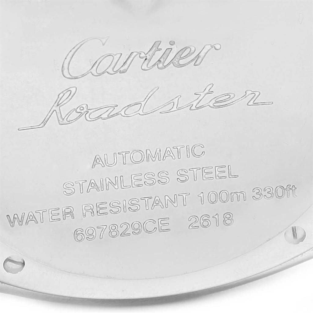 This image shows the engraved stainless steel back case of a Cartier Roadster W62019X6 Men's Stainless Steel Silver Dial W62019X6 Men's Stainless Steel Silver Dial watch.