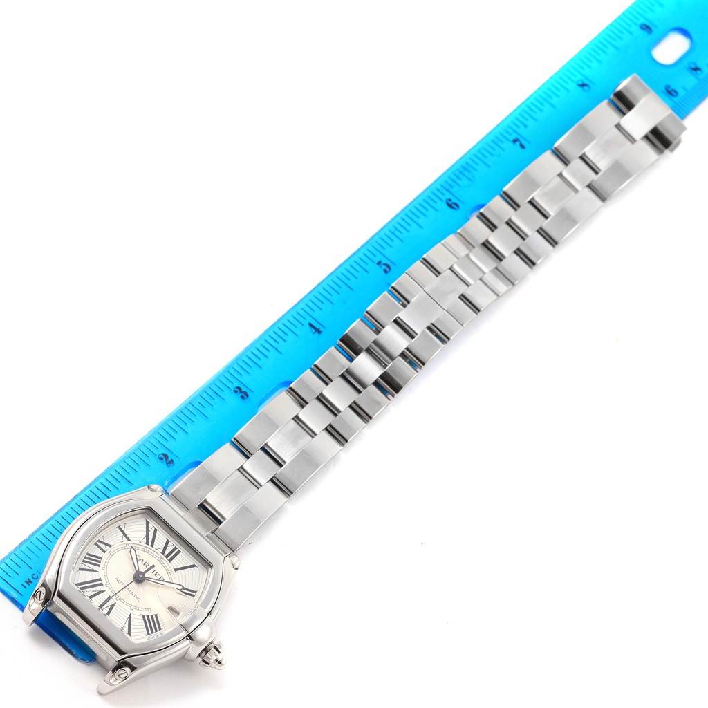 The image shows the full length, top-down view of the Cartier Roadster W62025V3 Men's Stainless Steel Silver Dial W62025V3 Men's Stainless Steel Silver Dial watch, with an adjacent ruler measuring its bracelet length.