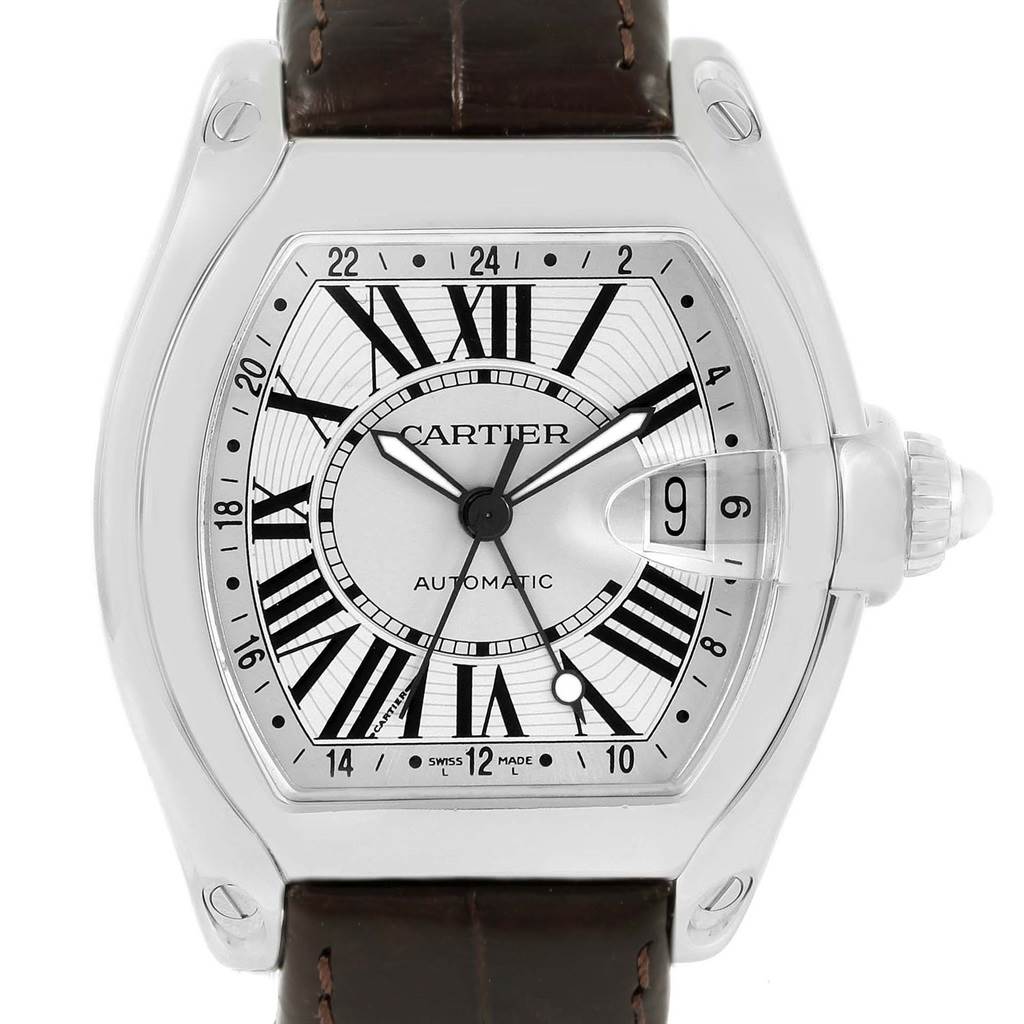 The image shows a frontal view of a Cartier Roadster W62032X6 Men's Stainless Steel Silver Dial W62032X6 Men's Stainless Steel Silver Dial model watch, displaying its dial, Roman numerals, and date window.