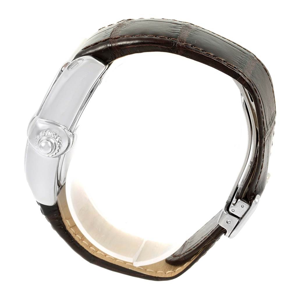 This image shows a Cartier Roadster W62032X6 Men's Stainless Steel Silver Dial W62032X6 Men's Stainless Steel Silver Dial watch from a side angle, highlighting its crown and leather strap with a clasp.