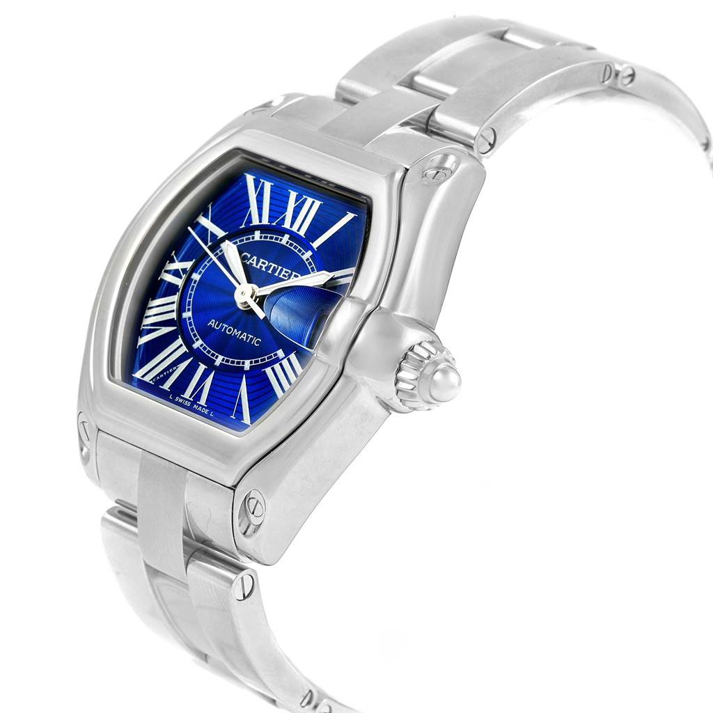 The Cartier Roadster W62048V3 Men's Stainless Steel Blue Dial W62048V3 Men's Stainless Steel Blue Dial watch is shown at a slight side angle, highlighting the dial, bracelet, and crown.