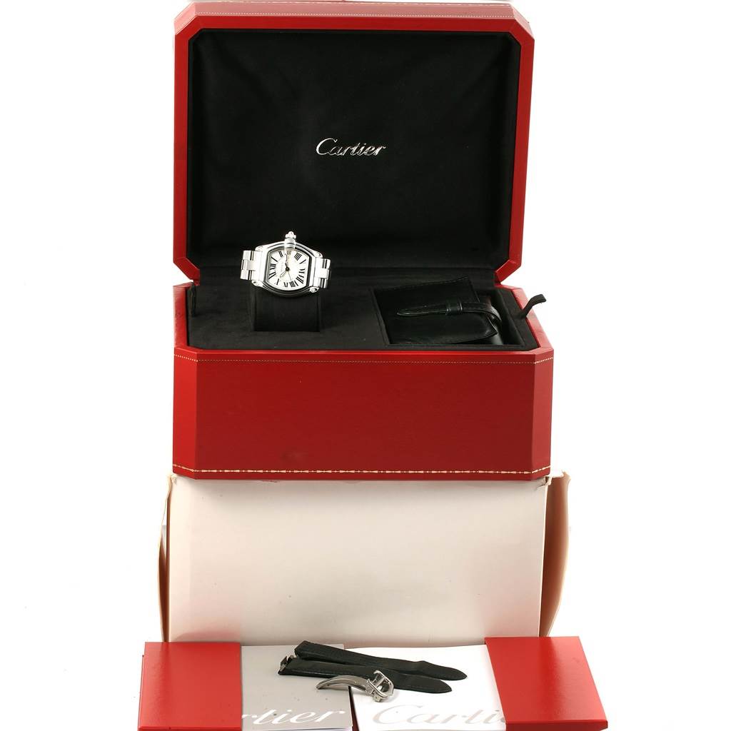 The image shows a Cartier Roadster W62025V3 Men's Stainless Steel Silver Dial W62025V3 Men's Stainless Steel Silver Dial watch in its box with additional straps and accessories.