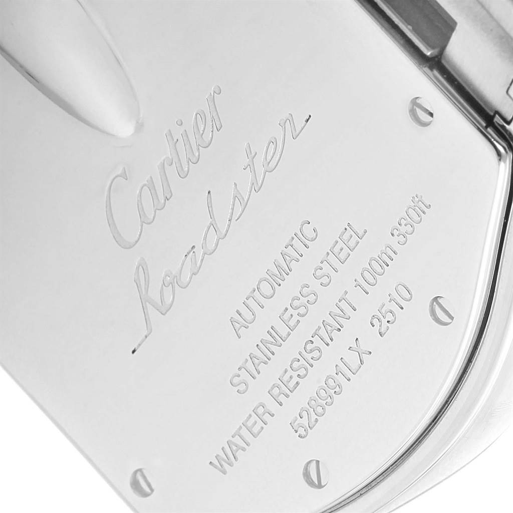 This is an angled view of the back case of a Cartier Roadster W62048V3 Men's Stainless Steel Blue Dial W62048V3 Men's Stainless Steel Blue Dial watch, showing its engravings and specifications.