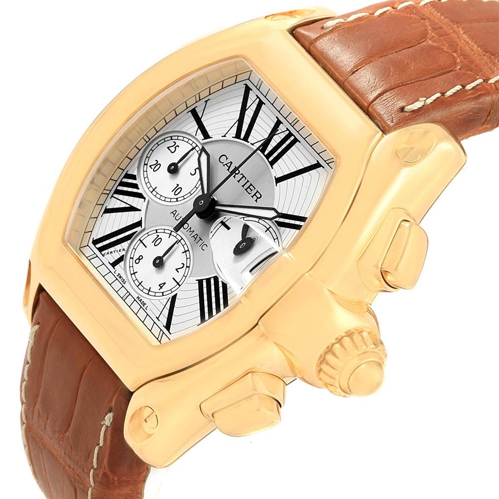 The image shows a close-up side angle of the Cartier Roadster W62021Y2 Men's Yellow Gold Silver Dial W62021Y2 Men's Yellow Gold Silver Dial watch, highlighting the dial, crown, and part of the leather strap.