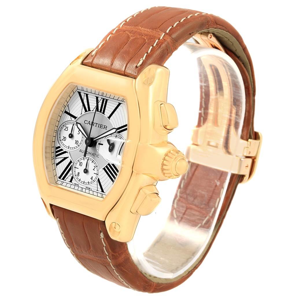 The image shows a Cartier Roadster W62021Y2 Men's Yellow Gold Silver Dial W62021Y2 Men's Yellow Gold Silver Dial watch at a slight side angle, highlighting the case, dial, crown, and leather strap.