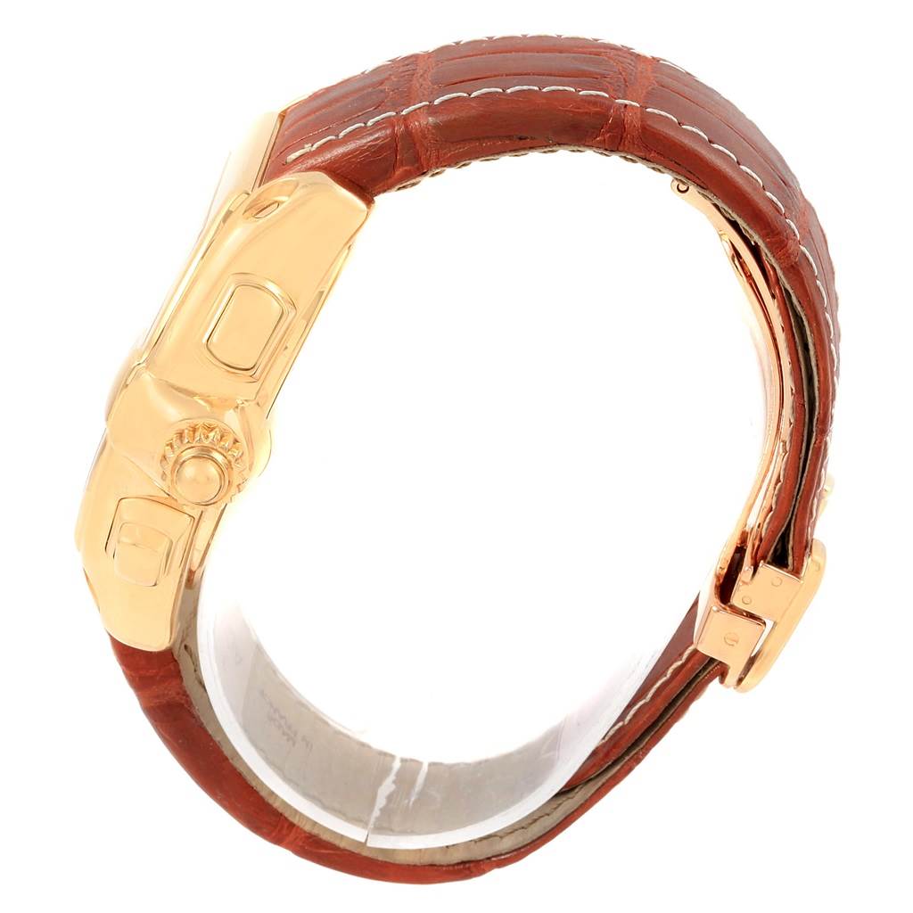 This image shows the side view of a Cartier Roadster W62021Y2 Men's Yellow Gold Silver Dial W62021Y2 Men's Yellow Gold Silver Dial watch, highlighting its crown and leather strap.