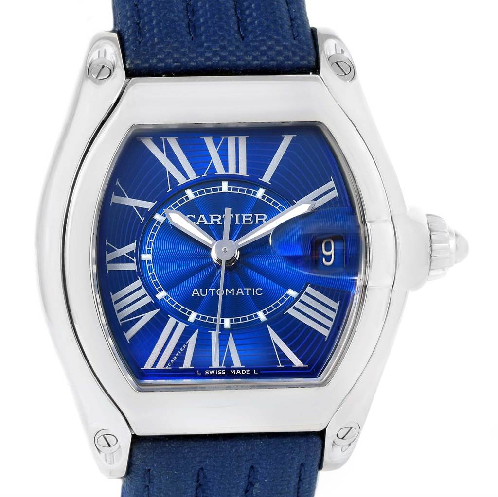 This image shows a Cartier Roadster W62048V3 Men's Stainless Steel Blue Dial W62048V3 Men's Stainless Steel Blue Dial watch face-on, displaying its blue dial, Roman numerals, and the date window at 3 o'clock.