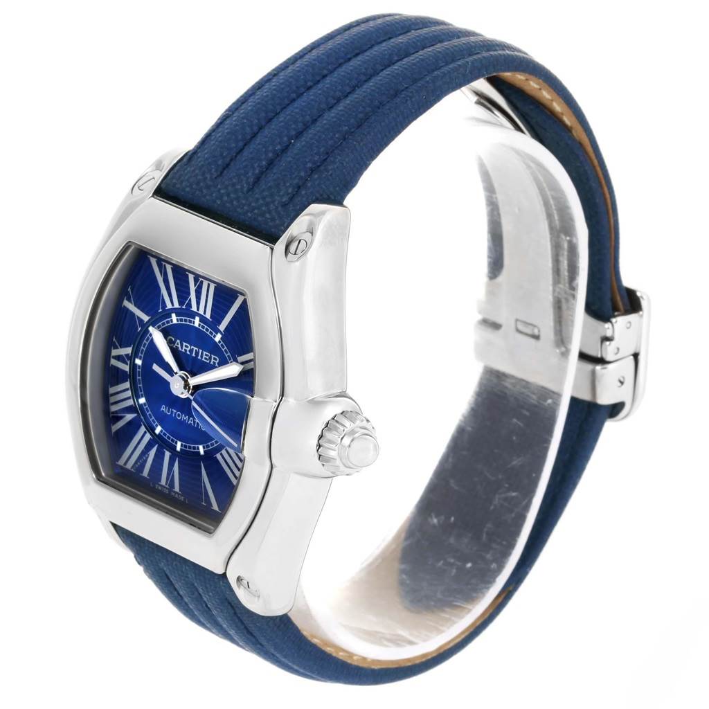 This image shows a Cartier Roadster W62048V3 Men's Stainless Steel Blue Dial W62048V3 Men's Stainless Steel Blue Dial watch from a side angle, highlighting its blue dial, silver case, and blue strap.