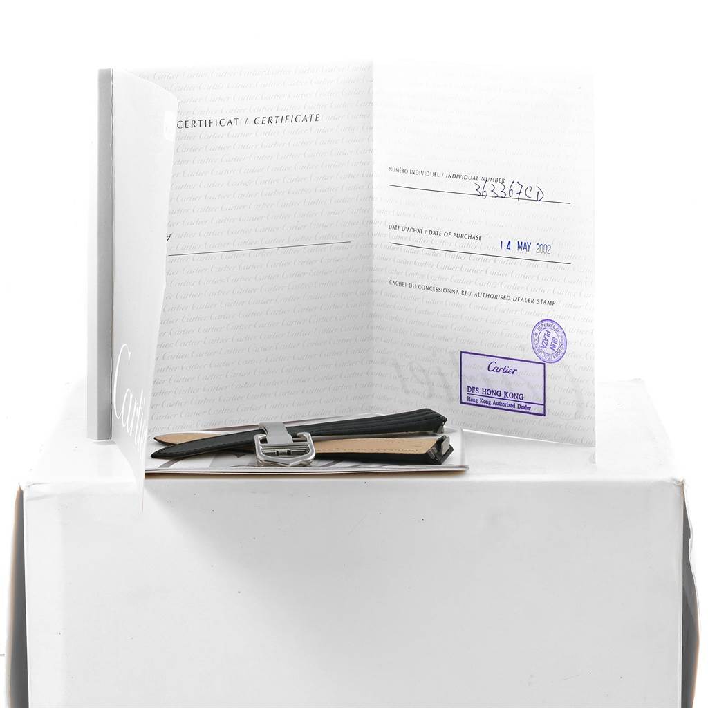 The image shows a warranty certificate and an extra strap for the Cartier Roadster W62002V3 Men's Stainless Steel Black Dial W62002V3 Men's Stainless Steel Black Dial watch.