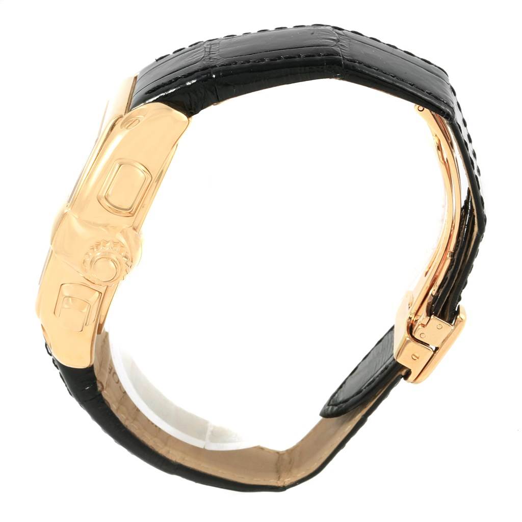 The image shows a side view of a Cartier Roadster W62021Y3 Men's Yellow Gold Champagne Dial W62021Y3 Men's Yellow Gold Champagne Dial watch, highlighting its gold case, crown, and black leather strap.