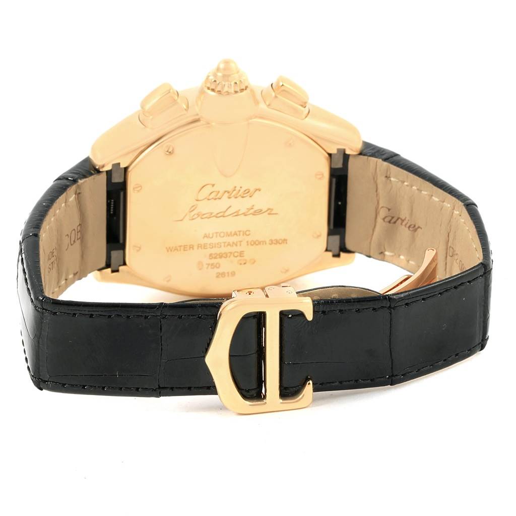 The image shows the back of a Cartier Roadster W62021Y3 Men's Yellow Gold Champagne Dial W62021Y3 Men's Yellow Gold Champagne Dial watch, focusing on the case back and leather strap with the Cartier logo on the buckle.