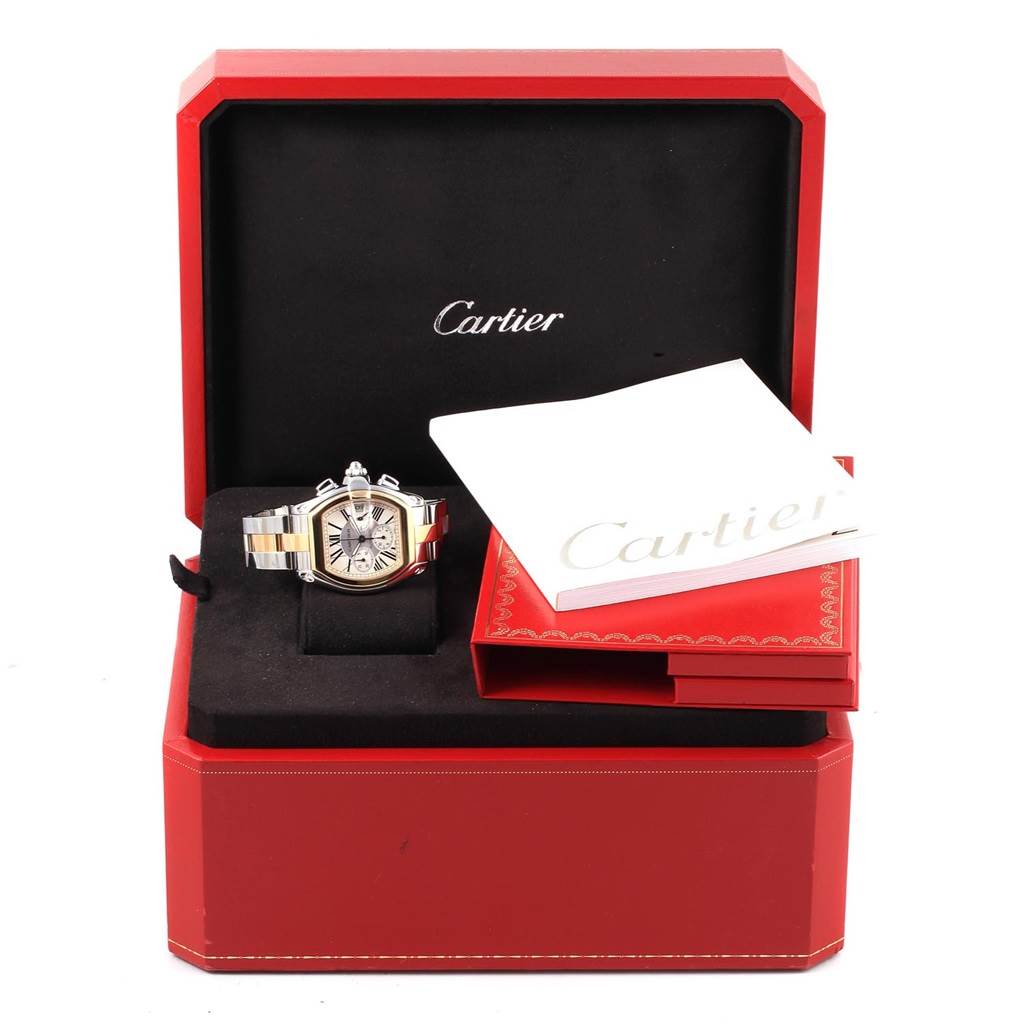 The Cartier Roadster W62027Z1 Men
s Steel and Gold (two tone) Silver Dial W62027Z1 Men
s Steel and Gold (two tone) Silver Dial watch and its accessories are shown from a front angle, including the box and documentation.