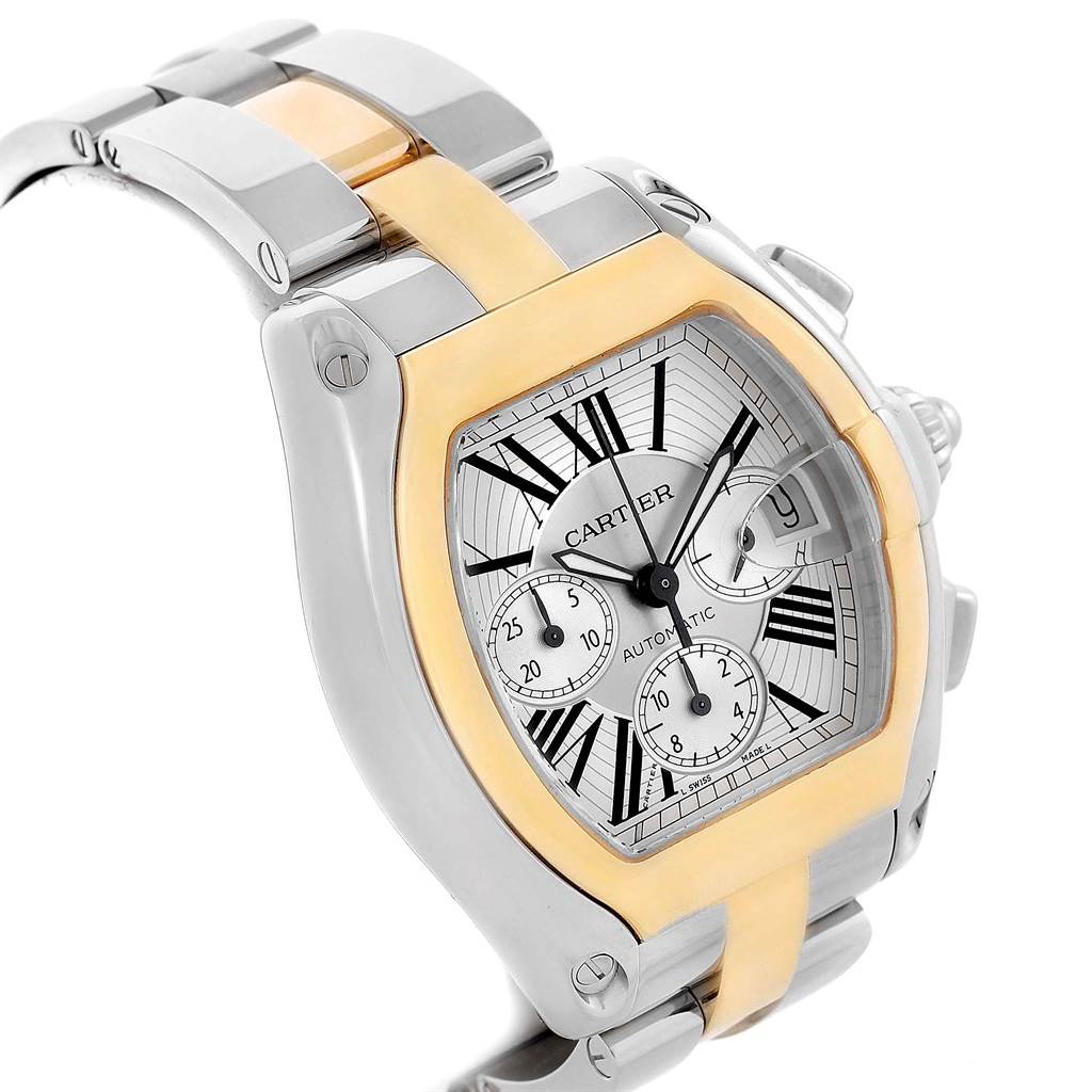 The image shows a close-up angle of the Cartier Roadster W62027Z1 Men
s Steel and Gold (two tone) Silver Dial W62027Z1 Men
s Steel and Gold (two tone) Silver Dial watch, highlighting its face, bezel, and part of the bracelet.
