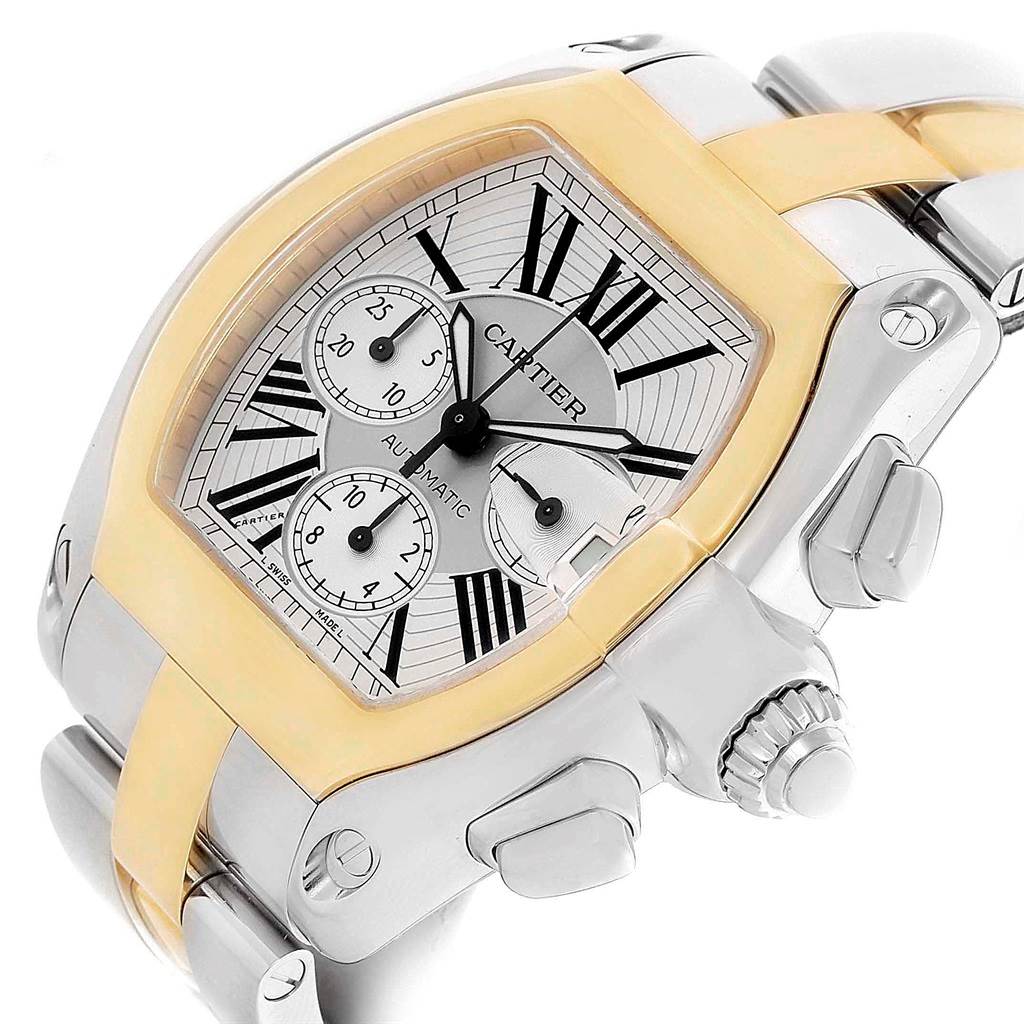 The image shows a close-up angle of a Cartier Roadster W62027Z1 Men
s Steel and Gold (two tone) Silver Dial W62027Z1 Men
s Steel and Gold (two tone) Silver Dial watch, highlighting the dial, crown, and part of the bracelet.