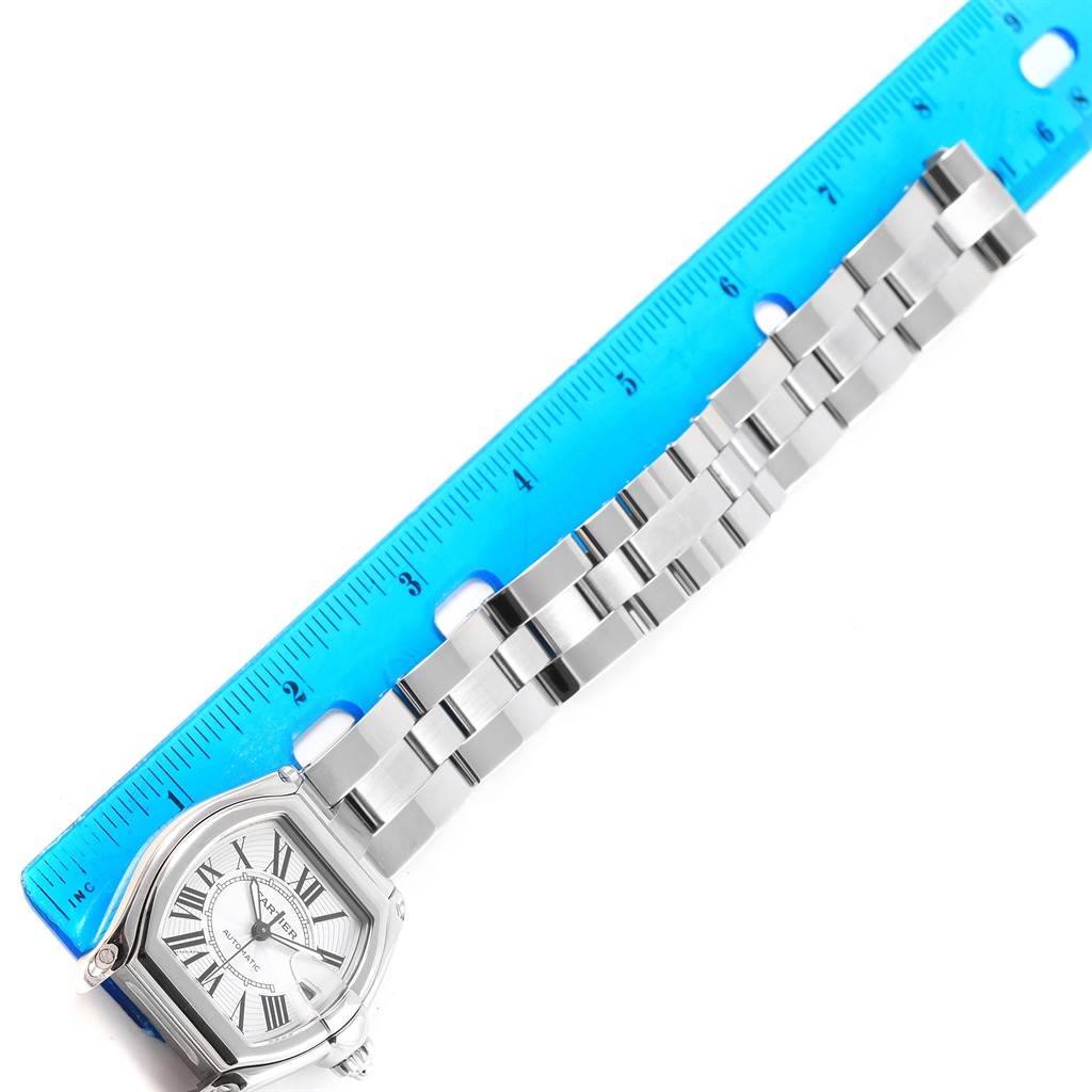 The image shows a Cartier Roadster W62025V3 Men
s Stainless Steel Silver Dial W62025V3 Men
s Stainless Steel Silver Dial watch, focusing on its face and metal strap, with a ruler indicating its length.