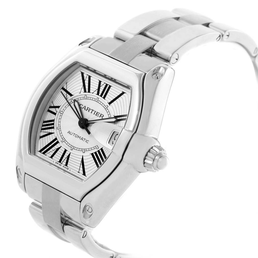 The Cartier Roadster W62025V3 Men
s Stainless Steel Silver Dial W62025V3 Men
s Stainless Steel Silver Dial watch is shown from an angled close-up, highlighting its dial, crown, and metal bracelet.