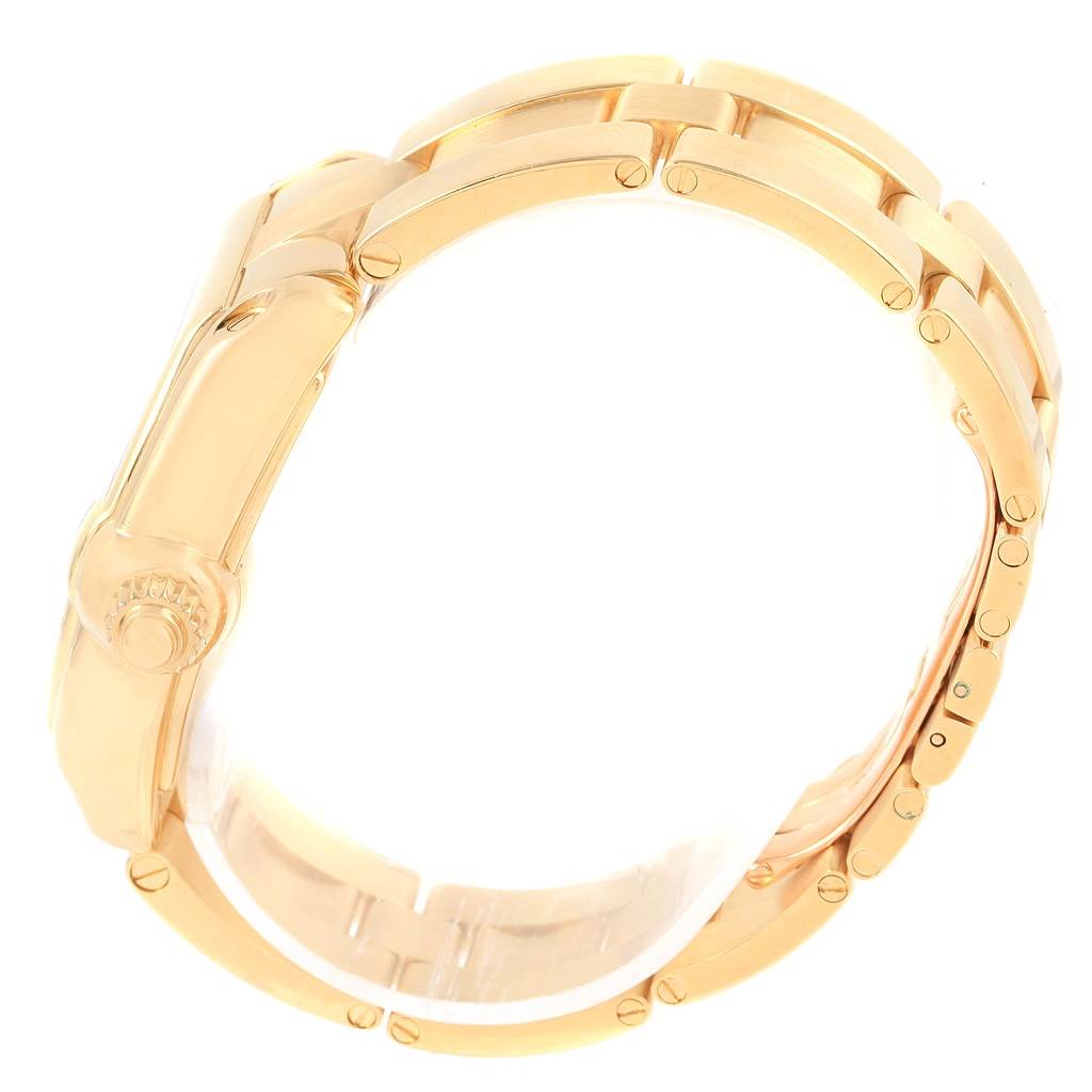 This image shows the side view and bracelet of the Cartier Roadster W62005V1 Men's Yellow Gold Silver Dial W62005V1 Men's Yellow Gold Silver Dial watch, highlighting the crown and golden links.