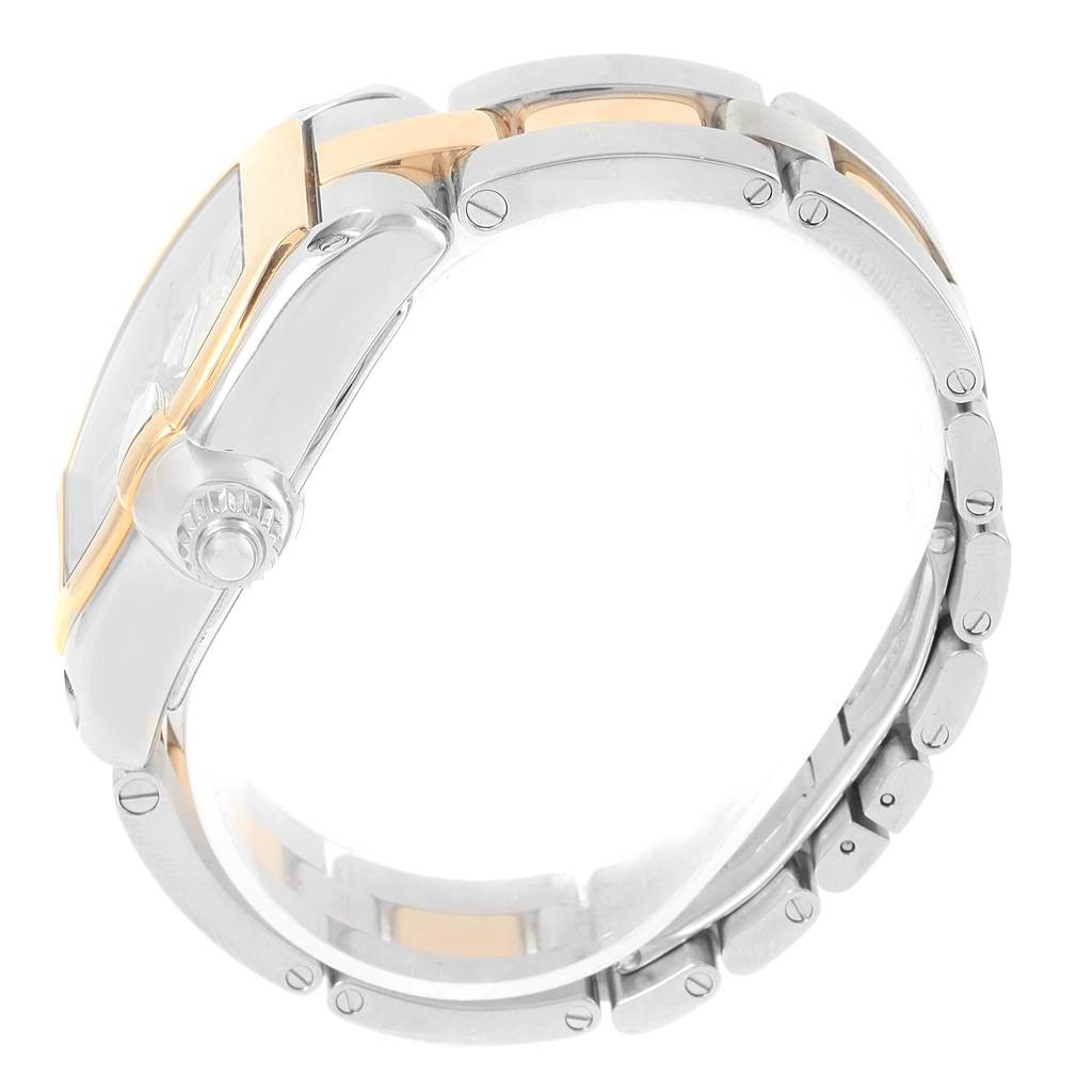 This image shows a side view of the Cartier Roadster W62031Y4 Men's Steel and Gold (two tone) Silver Dial W62031Y4 Men's Steel and Gold (two tone) Silver Dial watch, highlighting the crown and part of the bracelet.