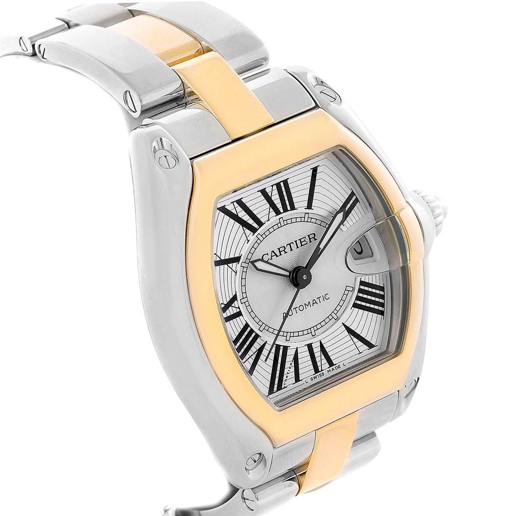 This image shows a close-up angle of a Cartier Roadster W62031Y4 Men's Steel and Gold (two tone) Silver Dial W62031Y4 Men's Steel and Gold (two tone) Silver Dial watch, highlighting its face, bezel, and bracelet with gold and silver tones.