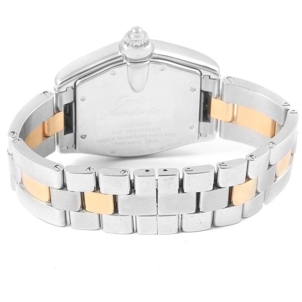 The image shows the back view of the Roadster model by Cartier, highlighting the case back and the metal bracelet with gold center links.