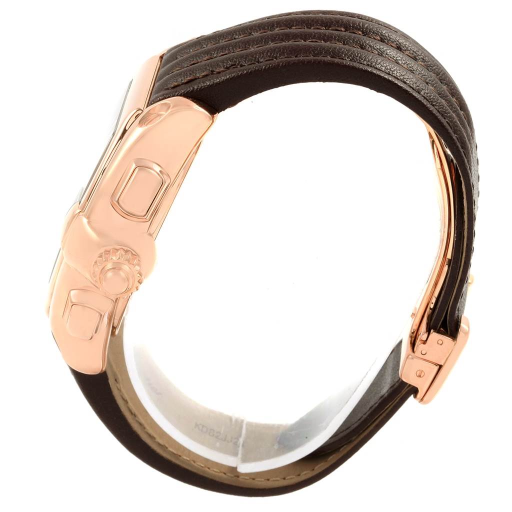 This image shows a side view of the Cartier Roadster W62042Y5 Men's Rose Gold Brown Dial W62042Y5 Men's Rose Gold Brown Dial model watch, focusing on the crown and clasp.
