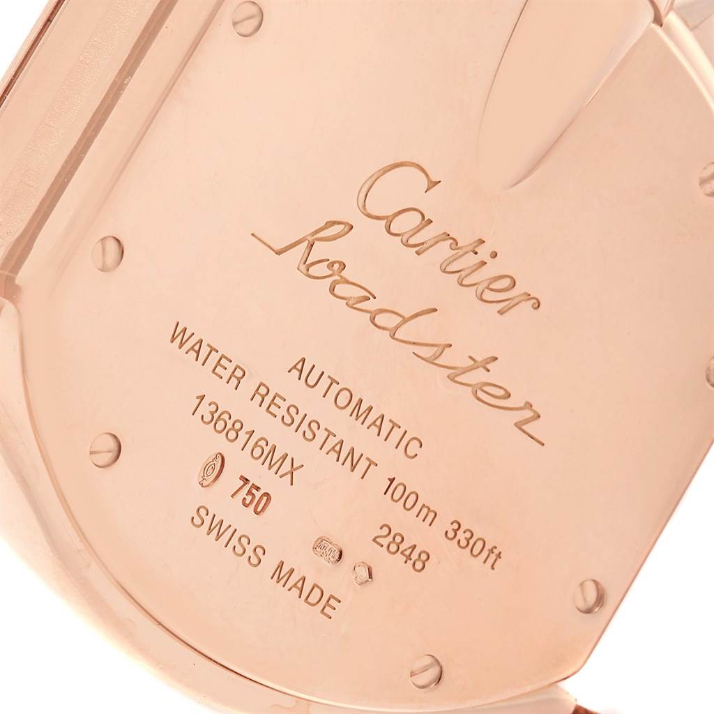 The image shows the case back of a Cartier Roadster W62042Y5 Men's Rose Gold Brown Dial W62042Y5 Men's Rose Gold Brown Dial watch, displaying engravings and screws.