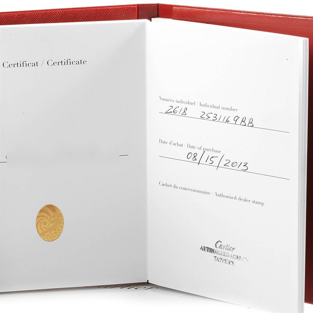 The image shows the opened certificate booklet for a Cartier Roadster W62019X6 Men
s Stainless Steel Silver Dial W62019X6 Men
s Stainless Steel Silver Dial watch, displaying purchase details and a dealer stamp.