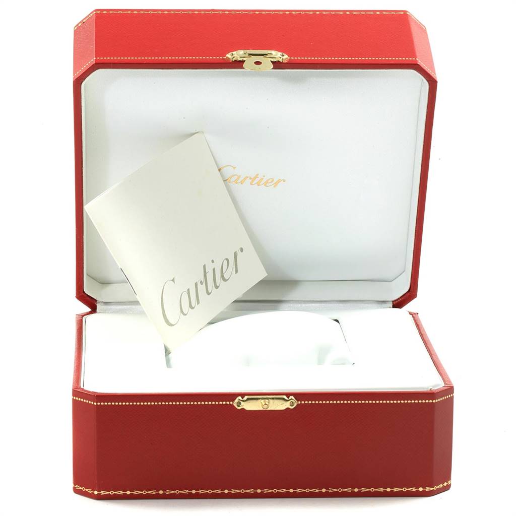 The image shows a Cartier Roadster W62005V2 Men's Yellow Gold Silver Dial W62005V2 Men's Yellow Gold Silver Dial watch box open, revealing an instruction booklet inside.