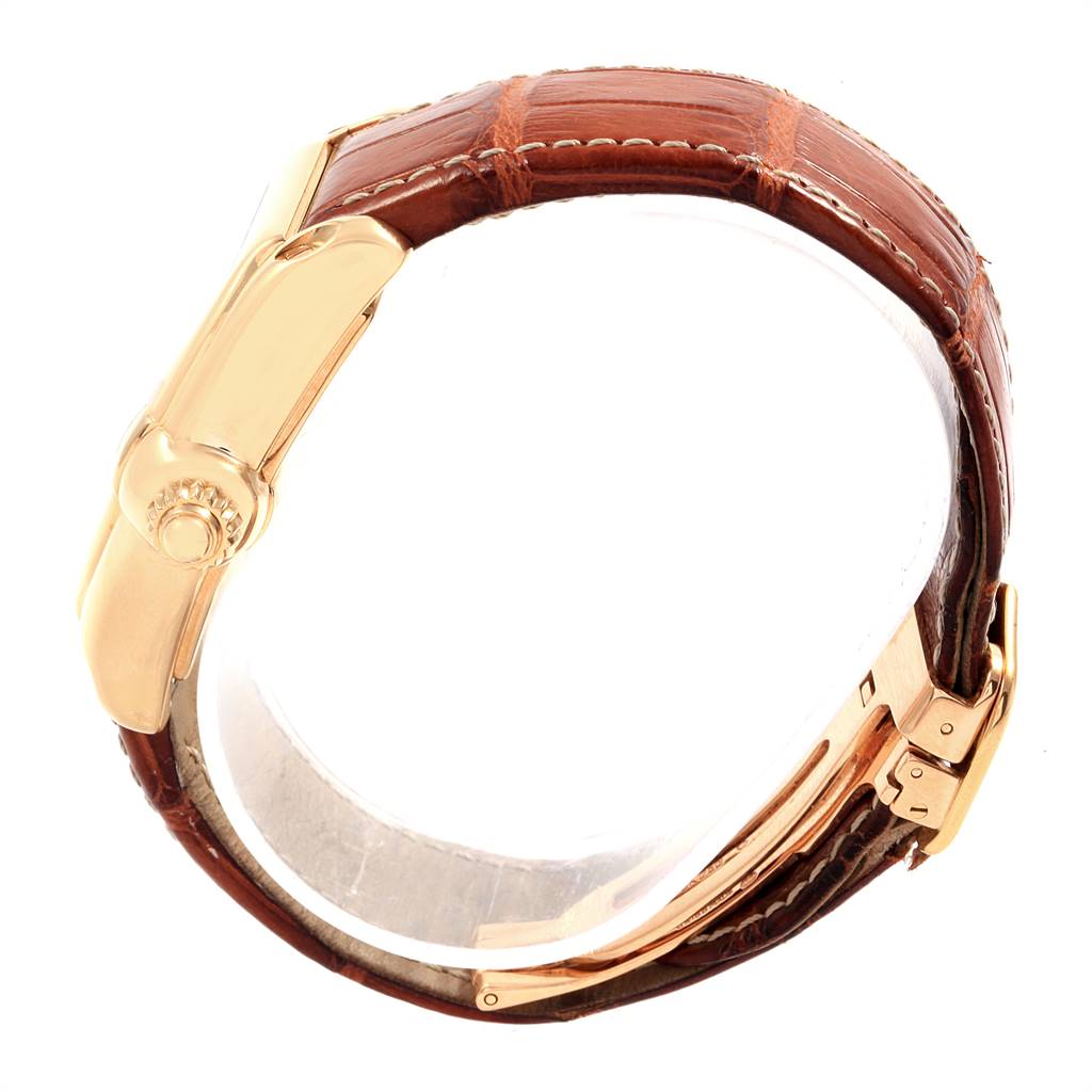 This image shows a side view of a Cartier Roadster W62005V2 Men's Yellow Gold Silver Dial W62005V2 Men's Yellow Gold Silver Dial watch, focusing on its leather strap and clasp.