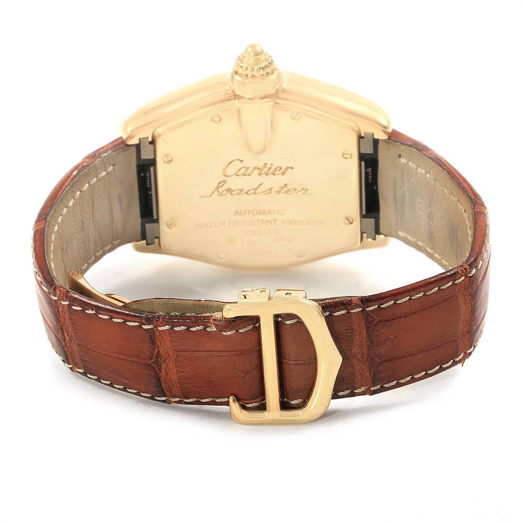 The image shows the back view of a Cartier Roadster W62005V2 Men's Yellow Gold Silver Dial W62005V2 Men's Yellow Gold Silver Dial watch, highlighting the leather strap and the engraved case back.