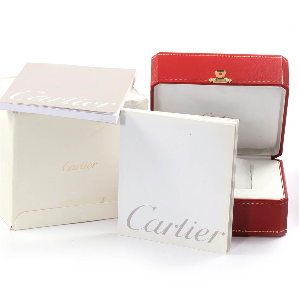 The image shows the packaging and accessories for a Cartier Roadster W62048V3 Men's Stainless Steel Blue Dial W62048V3 Men's Stainless Steel Blue Dial watch, including its box and instruction manuals.