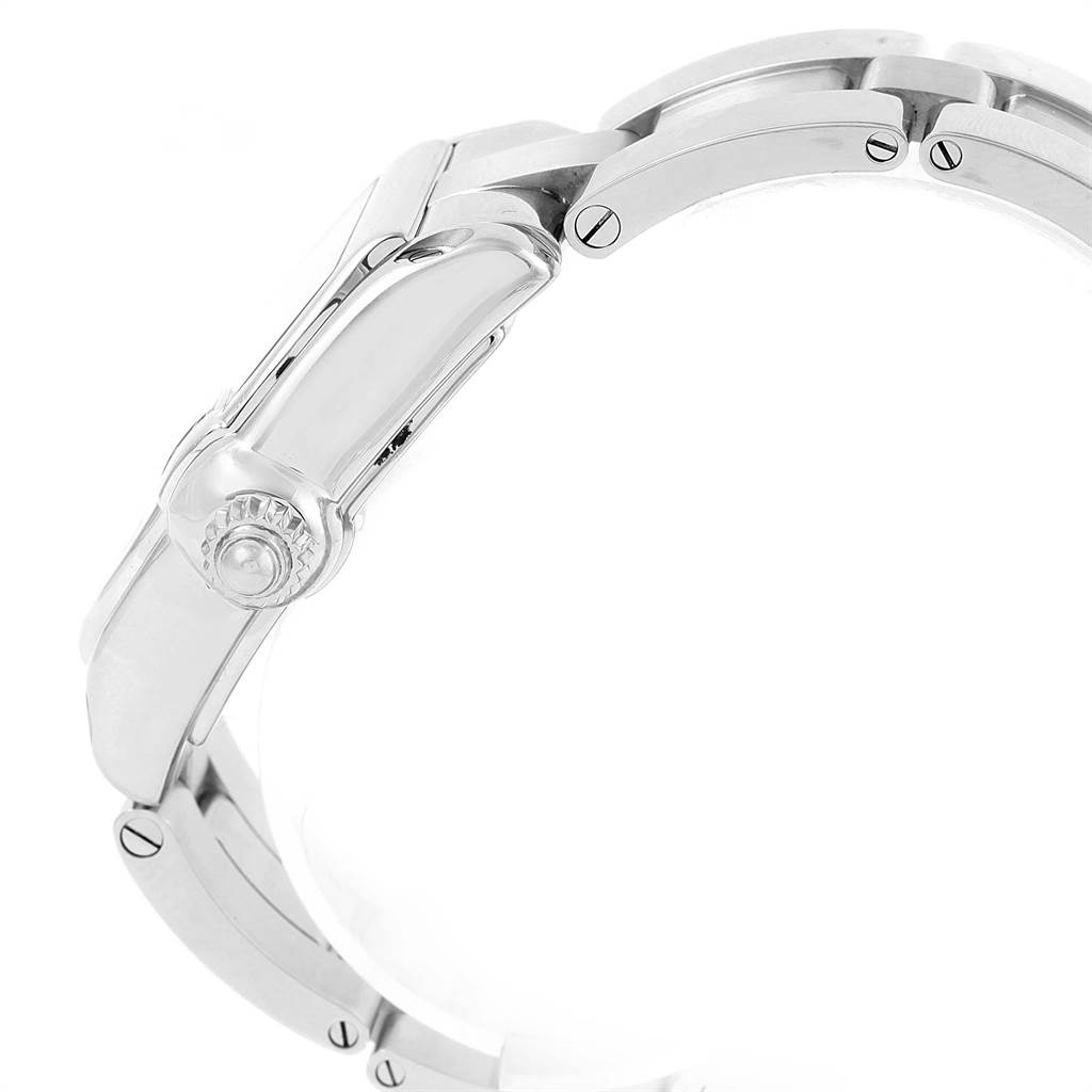 This image shows a side view of the crown and part of the bracelet of a Roadster model by Cartier.