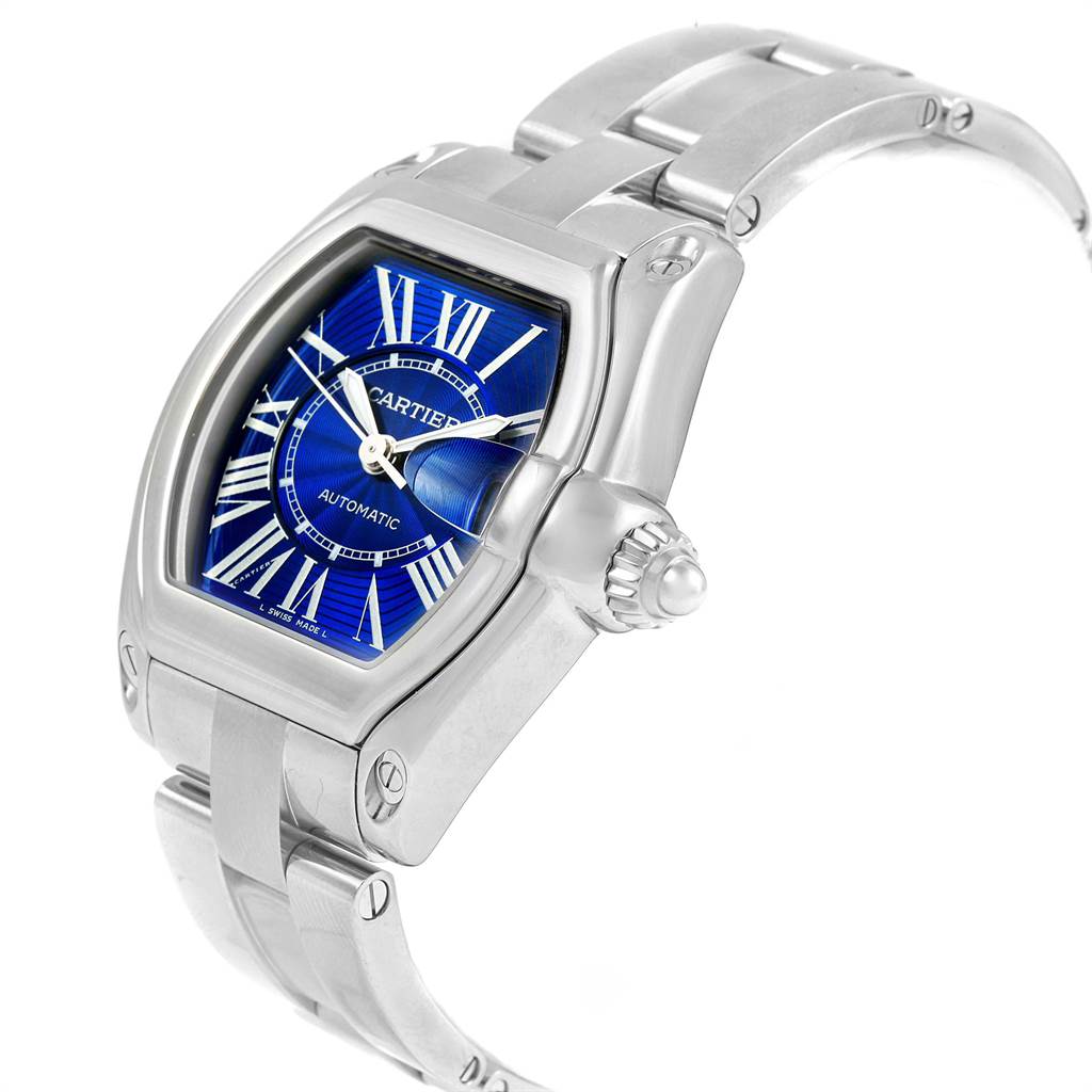 The image shows a Cartier Roadster W62048V3 Men's Stainless Steel Blue Dial W62048V3 Men's Stainless Steel Blue Dial watch from a front-side angle, highlighting the dial, bezel, crown, and part of the bracelet.