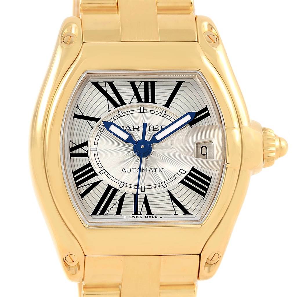 This image shows a front view of the Cartier Roadster W62005V1 Men's Yellow Gold Silver Dial W62005V1 Men's Yellow Gold Silver Dial watch, displaying its dial, hands, and part of the bracelet.