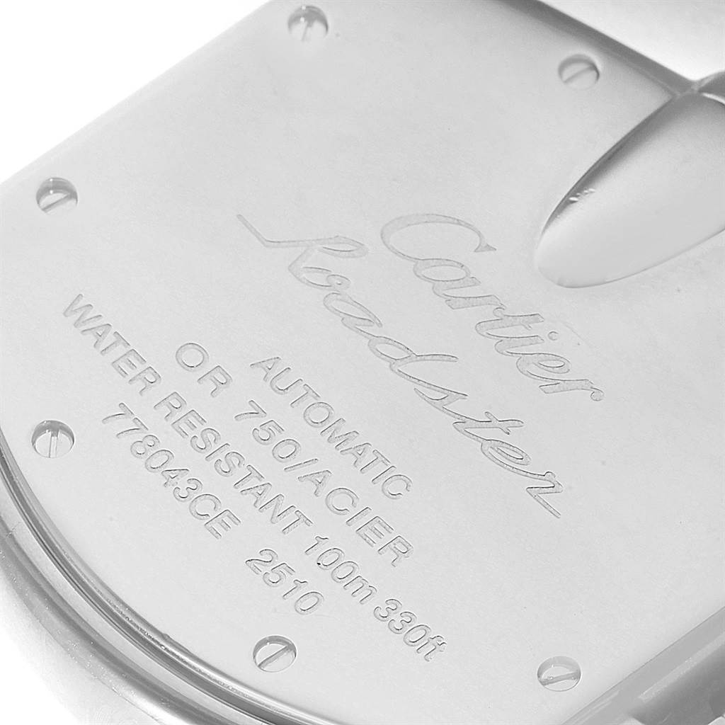 The image shows the back cover of a Cartier Roadster W62031Y4 Men
s Steel and Gold (two tone) Silver Dial W62031Y4 Men
s Steel and Gold (two tone) Silver Dial watch with engravings detailing its specifications.