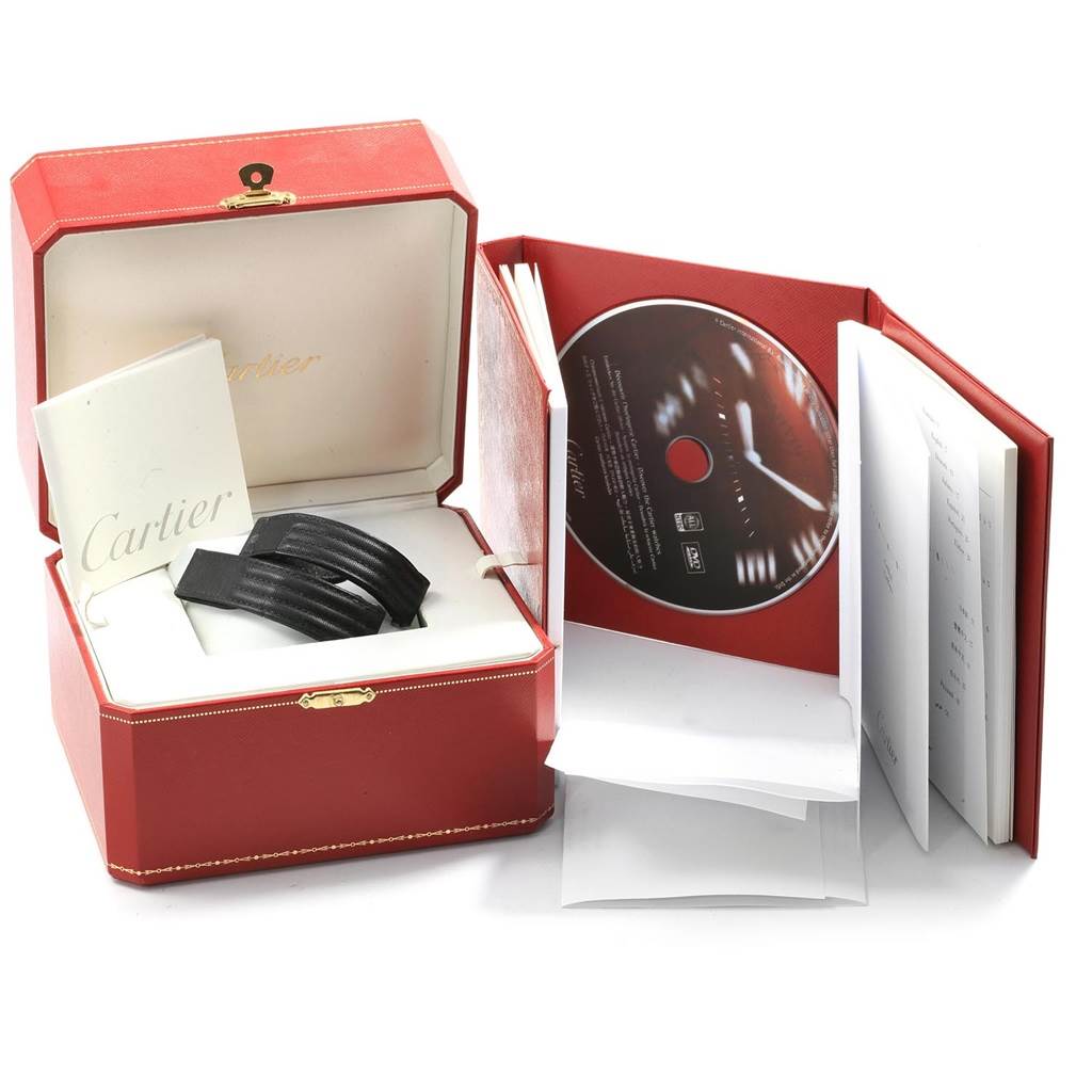 The image shows the Cartier Roadster W62025V3 Men
s Stainless Steel Silver Dial W62025V3 Men
s Stainless Steel Silver Dial model watch set with its box, booklet, extra straps, and a CD.