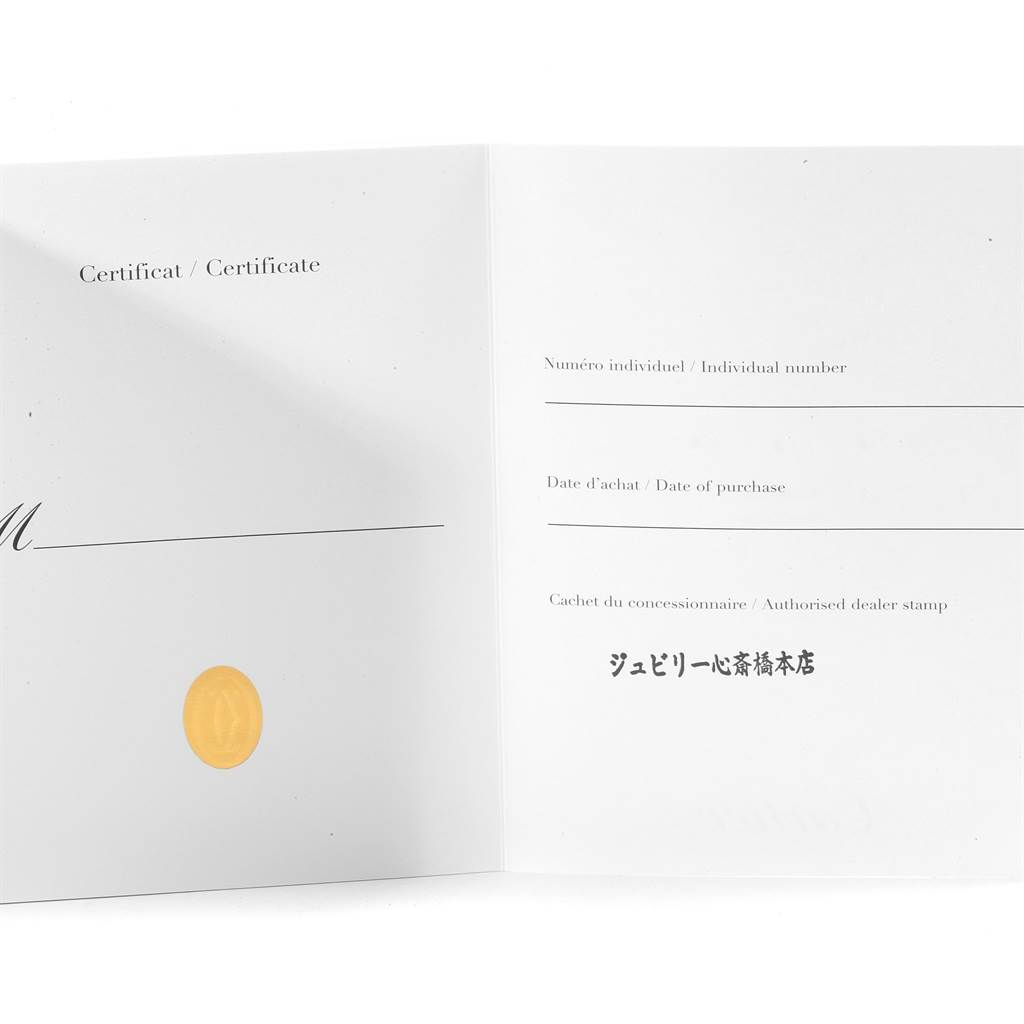 This is an image of the certificate booklet for the Cartier Roadster W6206020 Men's Stainless Steel Silver Dial W6206020 Men's Stainless Steel Silver Dial watch, showing the inside with blank fields for individual number, date of purchase, and dealer stamp.