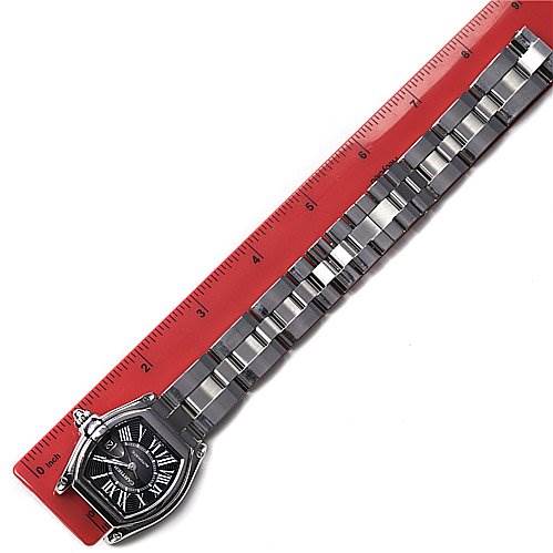 The Cartier Roadster W62025V3 Men's Stainless Steel Black Dial W62025V3 Men's Stainless Steel Black Dial watch is shown from a top-down angle, displaying the dial and full length of the metal bracelet alongside a ruler.