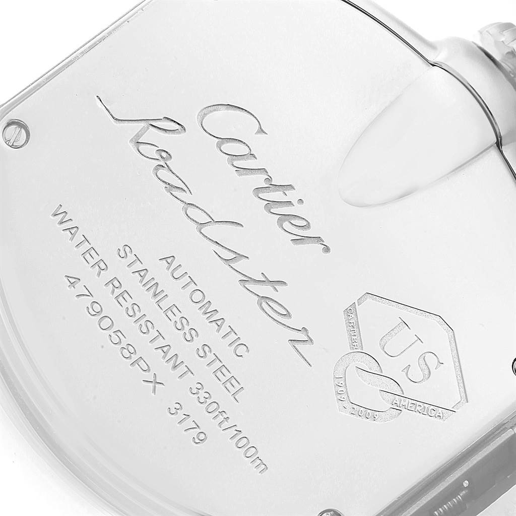 The image shows the back casing of the Cartier Roadster W6206012 Men
s Stainless Steel Blue Dial W6206012 Men
s Stainless Steel Blue Dial watch at an angled close-up, featuring engravings and seal details.