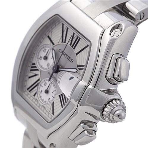 This image shows a close-up of the Cartier Roadster W62019X6 Men's Stainless Steel Silver Dial W62019X6 Men's Stainless Steel Silver Dial watch, focusing on the side and crown with part of the dial visible.
