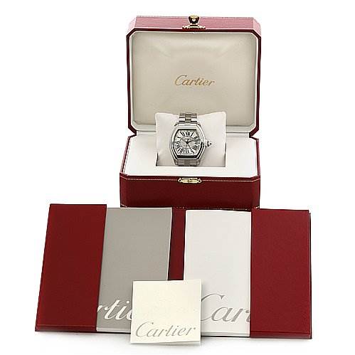 The Cartier Roadster W62032X6 Men's Stainless Steel Silver Dial W62032X6 Men's Stainless Steel Silver Dial watch is shown inside its open box at a frontal angle, along with accompanying booklets.