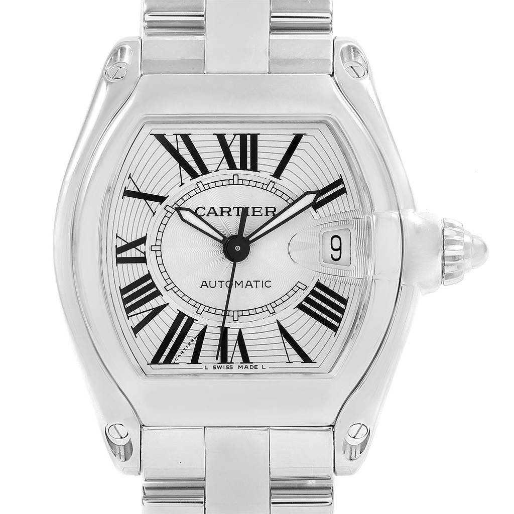 The image shows a front view of the Cartier Roadster W62025V3 Men
s Stainless Steel Silver Dial W62025V3 Men
s Stainless Steel Silver Dial watch, highlighting the face, Roman numeral markers, and date window.