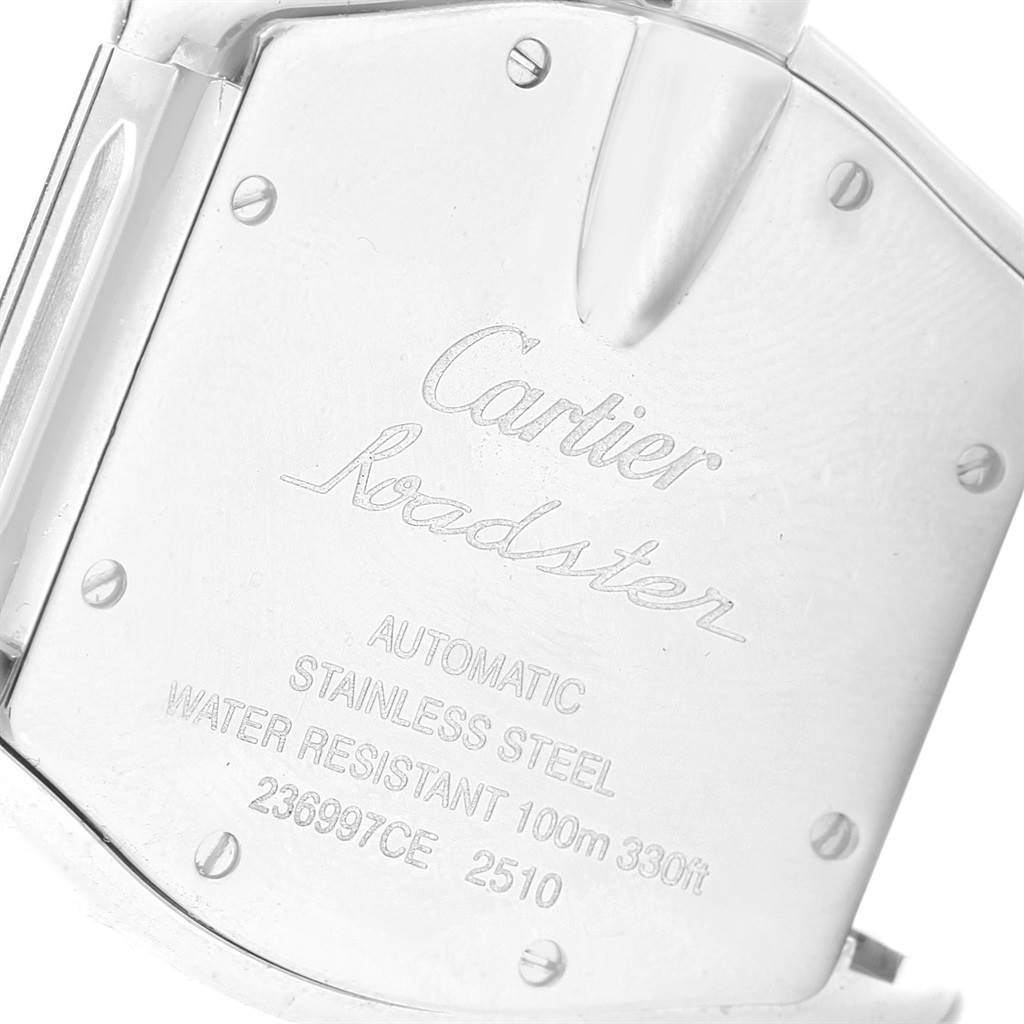 This image shows a close-up of the back case of a Cartier Roadster W62025V3 Men
s Stainless Steel Silver Dial W62025V3 Men
s Stainless Steel Silver Dial watch, highlighting engravings and screws.