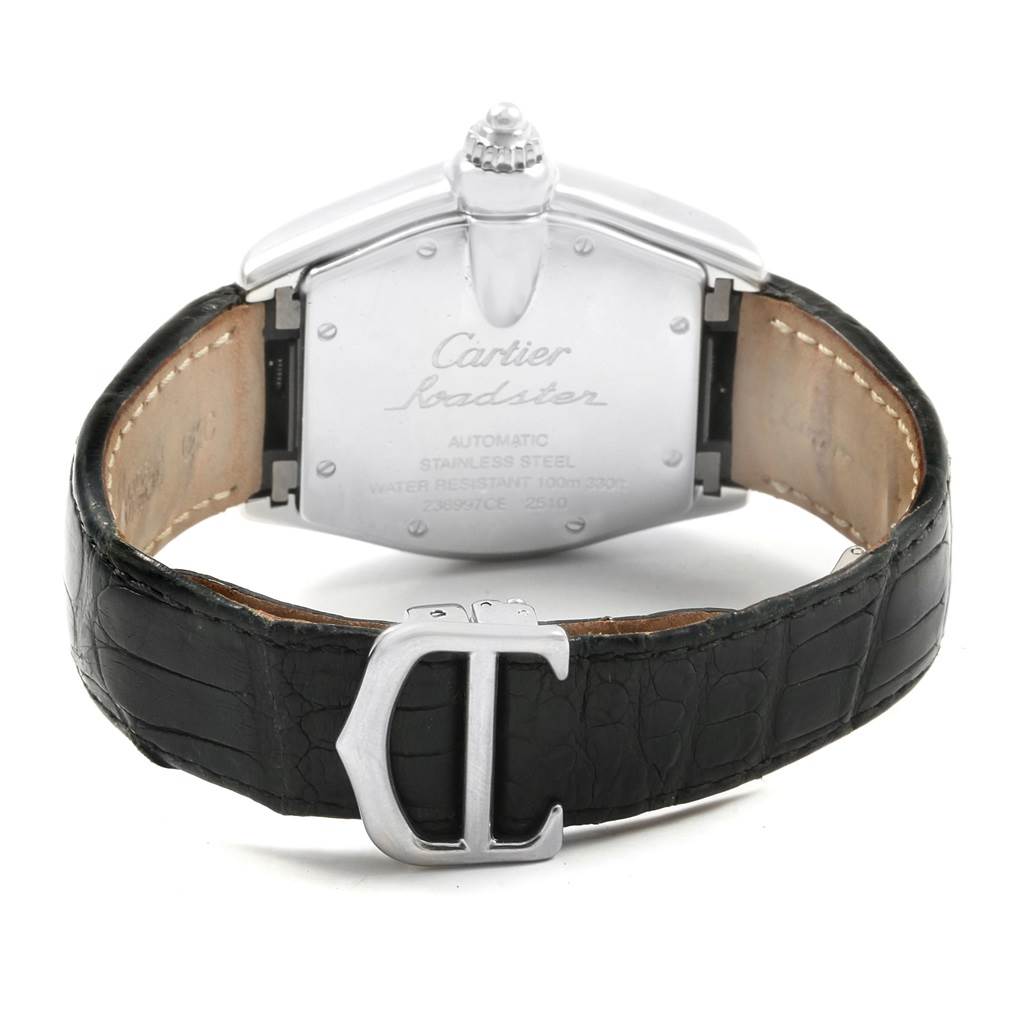 The image shows the back view of a Cartier Roadster W62025V3 Men
s Stainless Steel Silver Dial W62025V3 Men
s Stainless Steel Silver Dial watch, highlighting its stainless steel case, leather strap, and clasp.